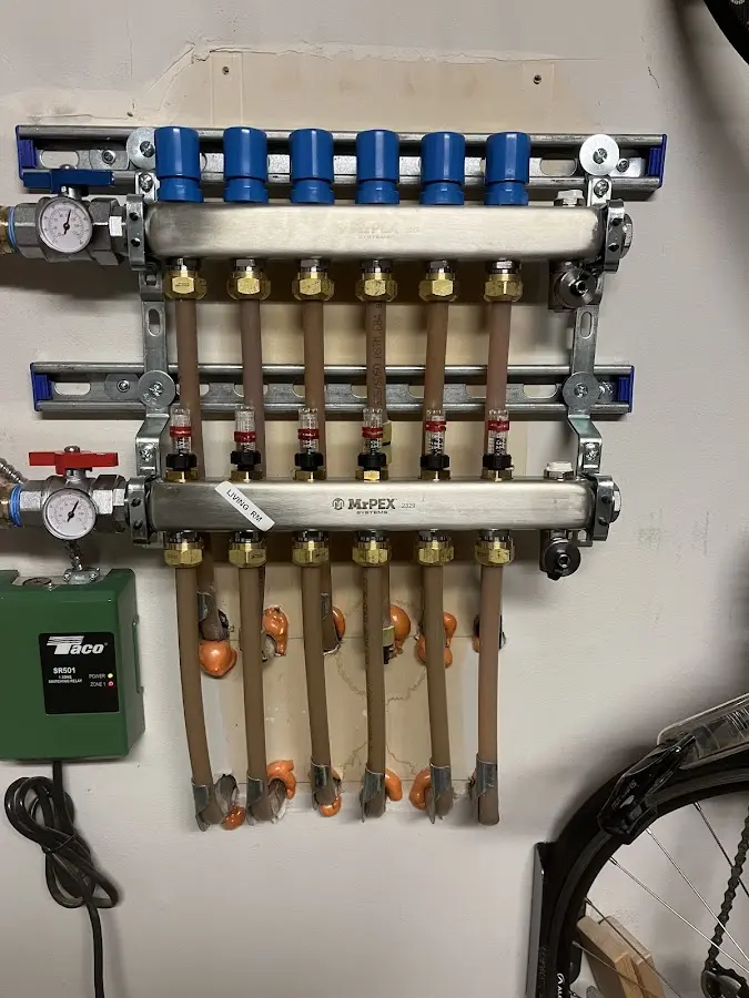 Plumber performing Water Heater Repair at a residential property in Bayport